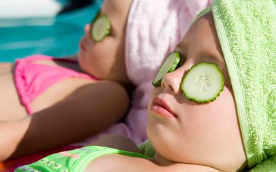 girls with cucumber slices on eyes at spa - spoiled kids