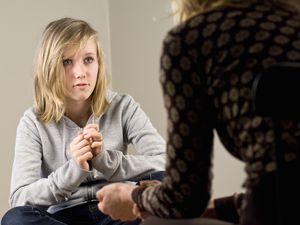 teenager talking to therapist