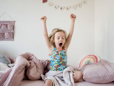 Child stretching and yawning as they wake up