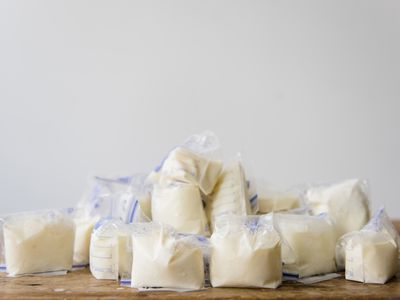 Bags of frozen breast milk on table