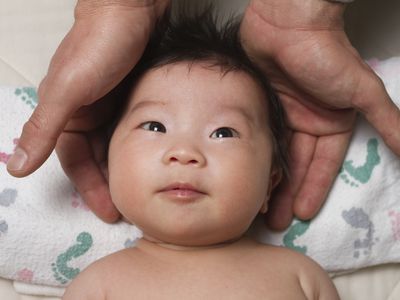 Newborn in someone's hands