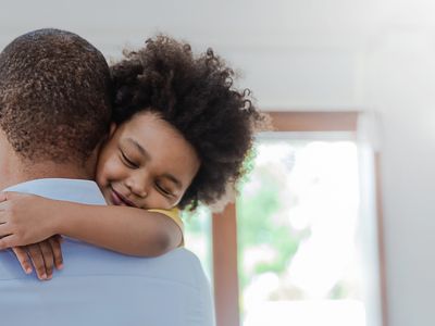 father hugging child