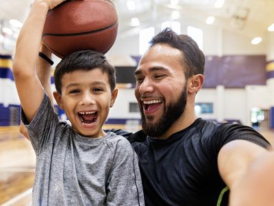 father and son at basketball practice