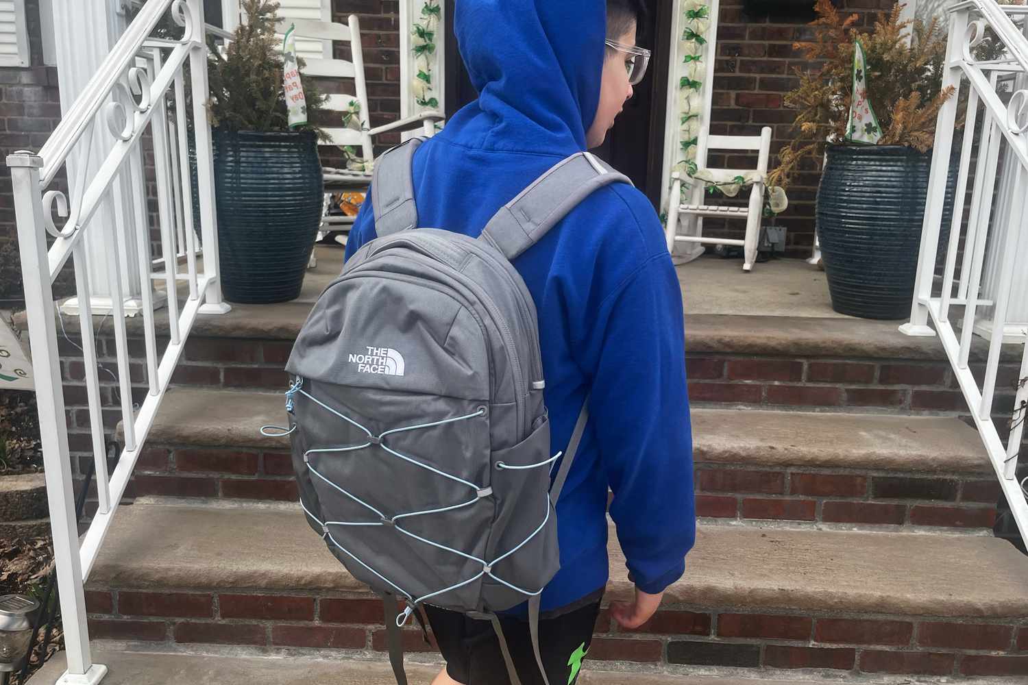 A child wearing The North Face Borealis backpack