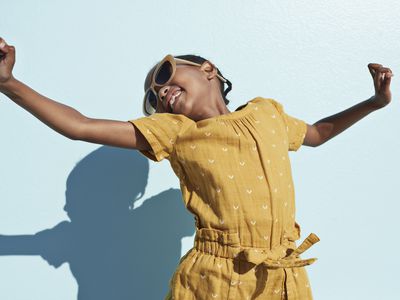 Portrait of jumping cool girl with sunglasses