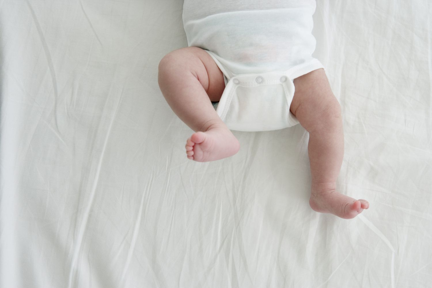 image of baby's legs in a onesie