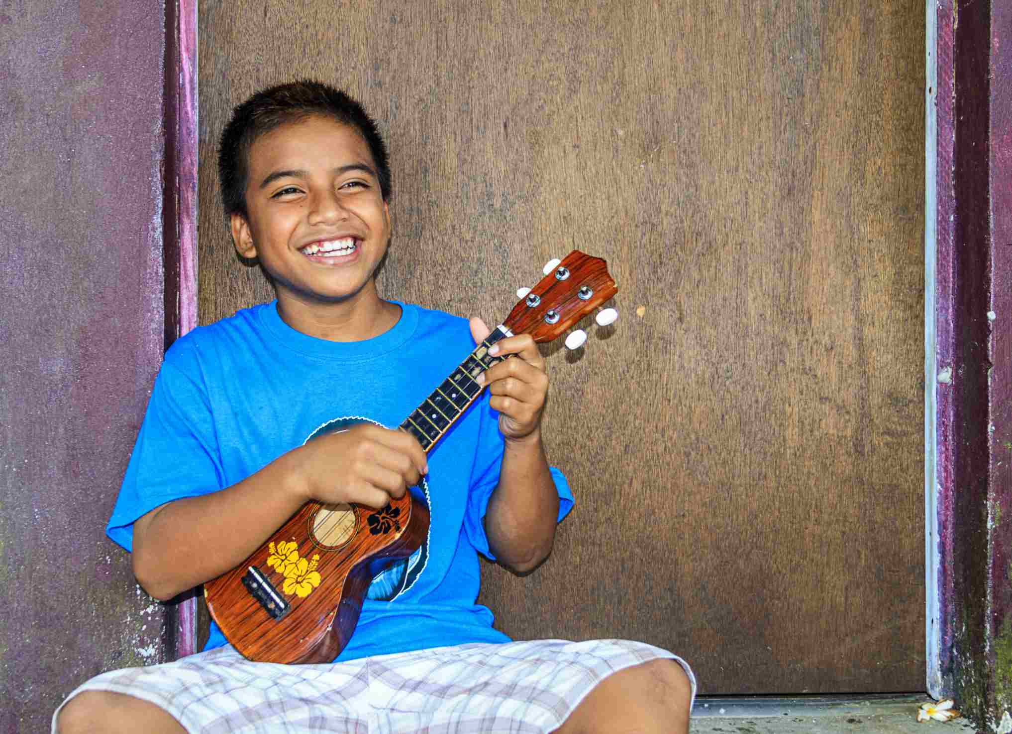 Boy playing a ukelele