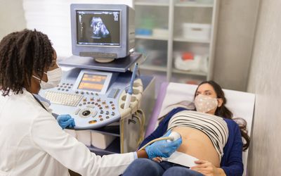 Pregnant woman receiving ultrasound