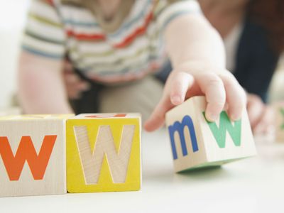 Baby boy spelling WWW with blocks