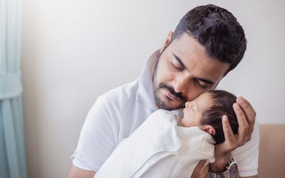 Father holding his newborn baby