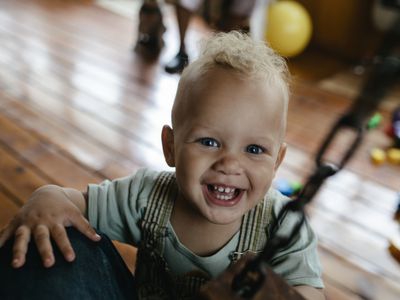 Portrait of Interracial toddler smiling and looking into camera. Black middle class America family