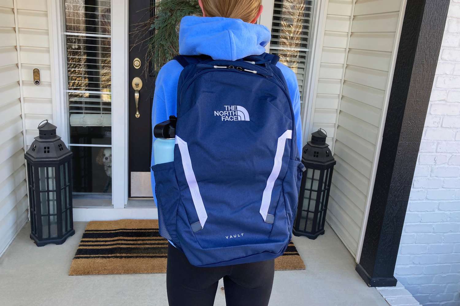 A kid wearing The North Face Vault Backpack