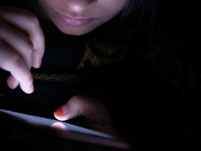 young women using phone communicating with friends