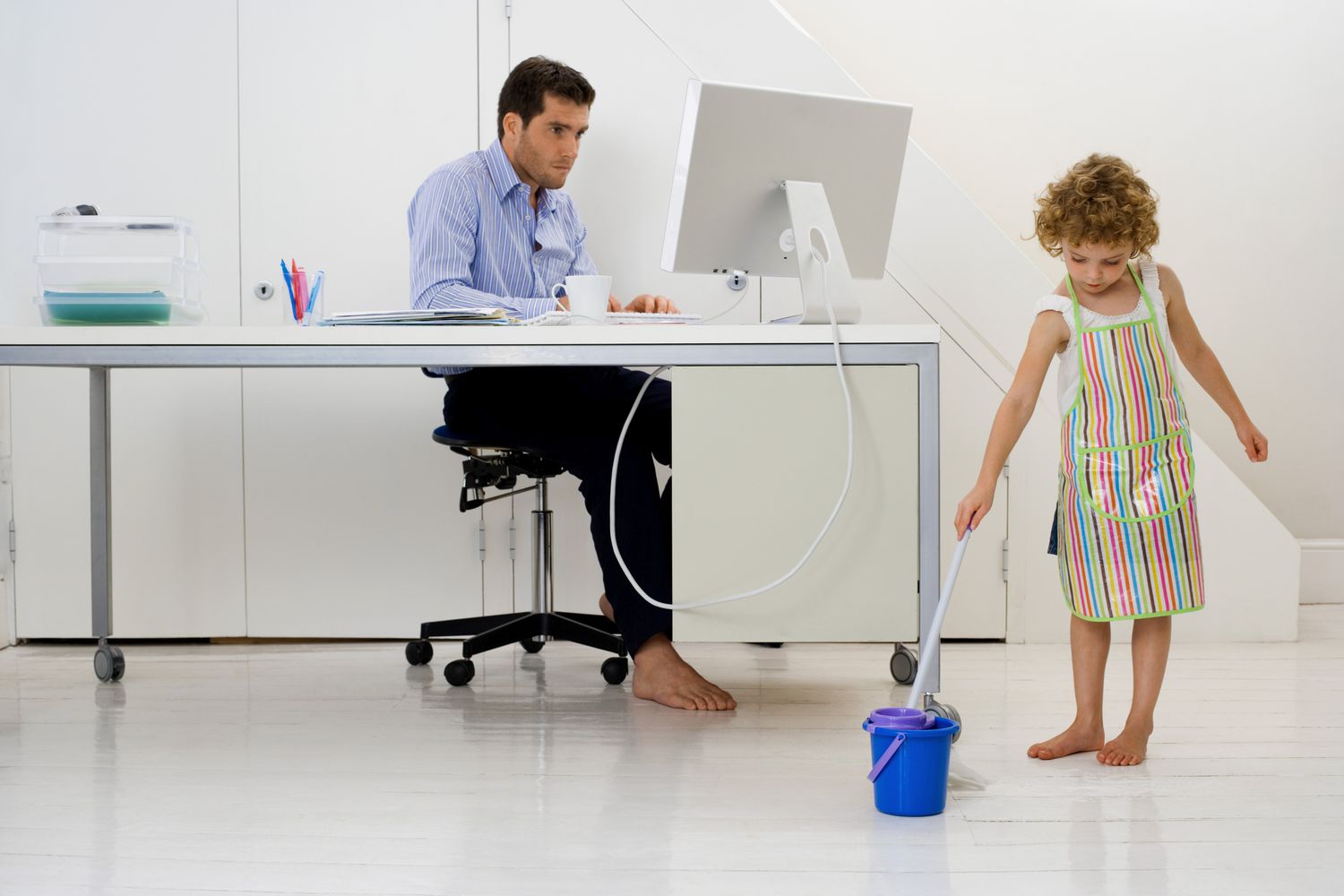 Father and daughter in home office