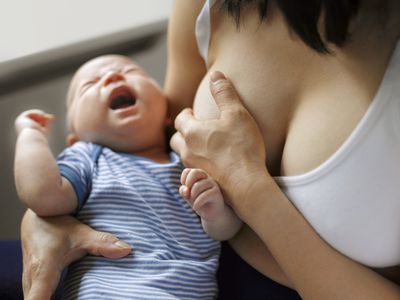baby crying breastfeeding
