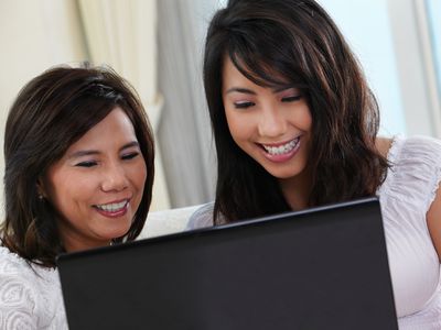 mom and daughter on a laptop