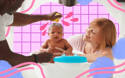 Parents giving baby a bath