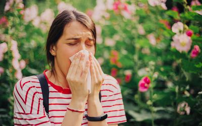 Woman sneezing