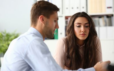 man and woman thoughtfully considering options