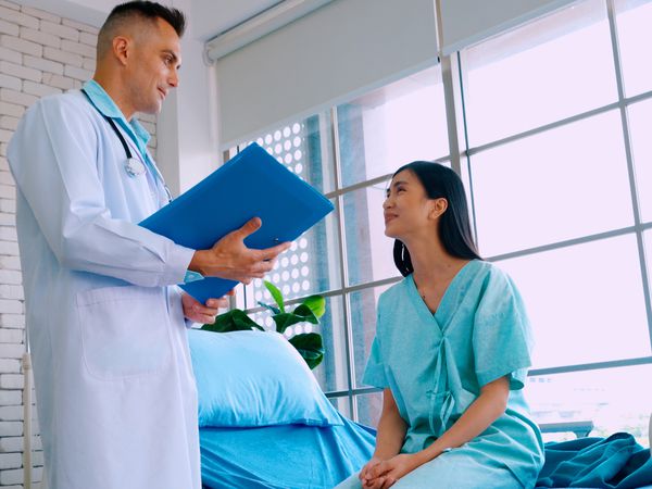 Doctor consults with patient before D&C