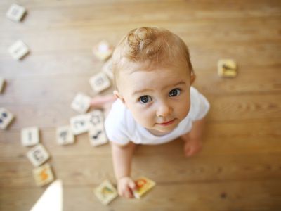 A 9 months old baby playing