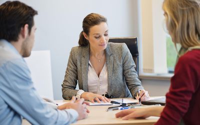 Business executive discussing with her clients