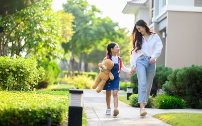 mom and daughter walking