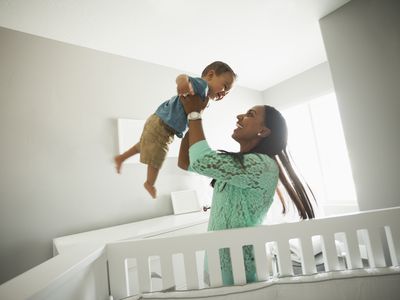 Woman holding her baby up