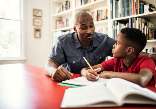 Father helping son with homework