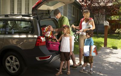 Family packing car for trip