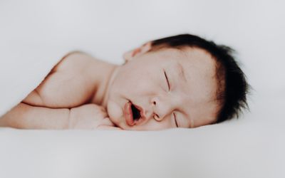 Sleeping baby with open mouth