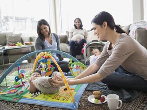 A picture of moms with their kids at a play date