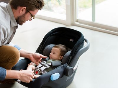 dad with newborn car seat