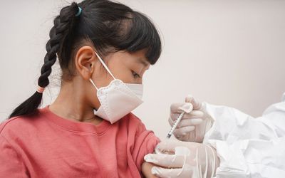 Little girl getting a COVID vaccine