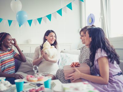 Four women celebrating at a baby shower
