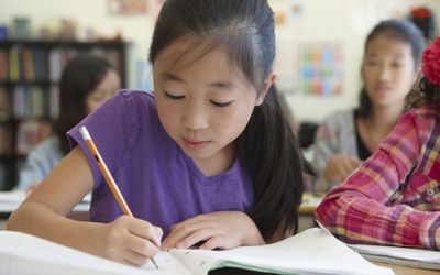 girl working in elementary school class