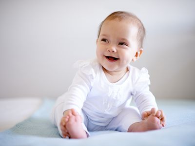 Baby sitting on a blanket