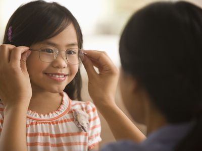 Child being fitted for glasses