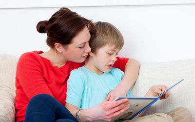 Mother and son reading together