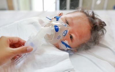 Baby with RSV being treated in a hospital