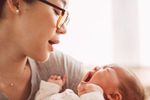 Mom calming a crying baby in her arms