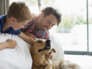 Parent with dog and child