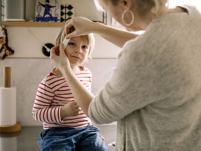 Mom tending to a child's wound