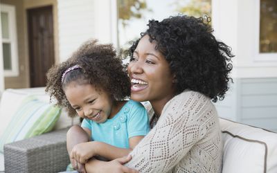 Mom and daughter laughing together