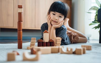 Creative child playing with blocks