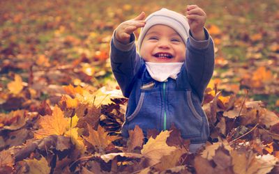 baby in leaves