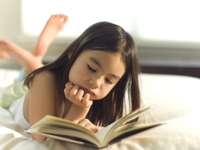 Little Girl Reading a Book