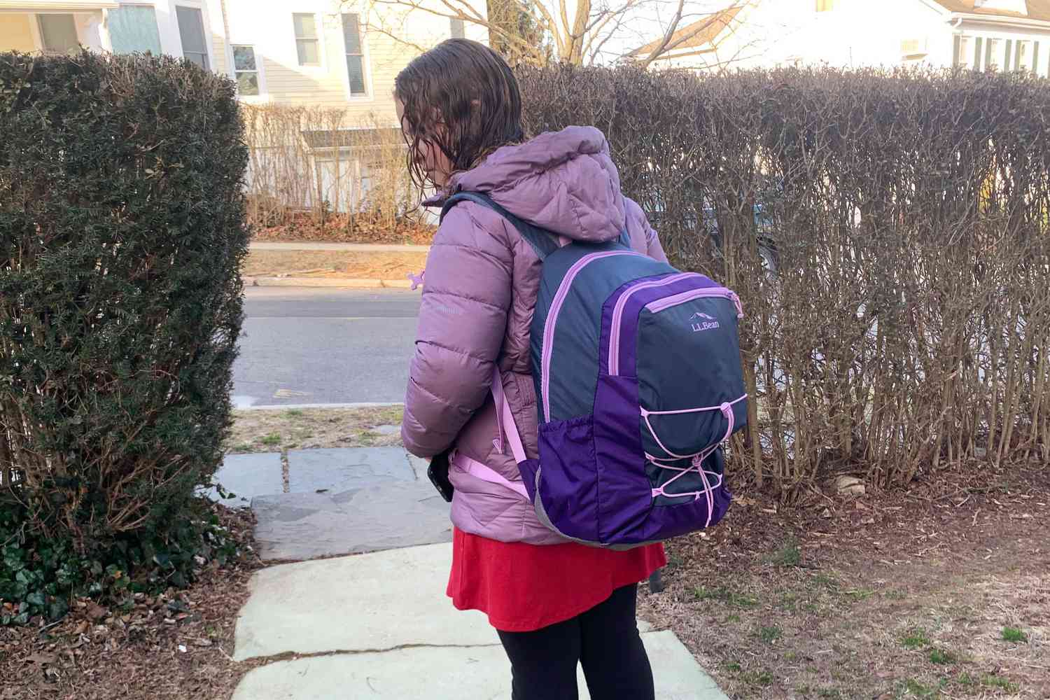 A child wearing the L.L.Bean Comfort Carry Laptop Backpack