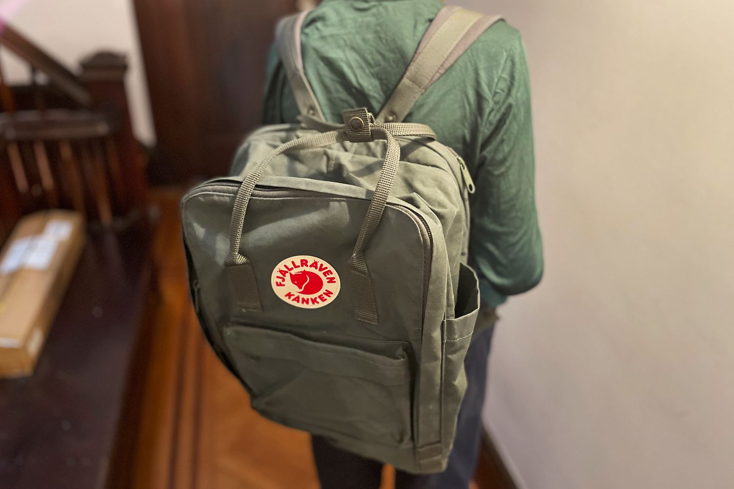 A student wearing the Fjallraven KÃ¥nken laptop backpack