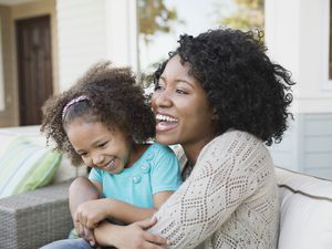 Mom and daughter laughing together